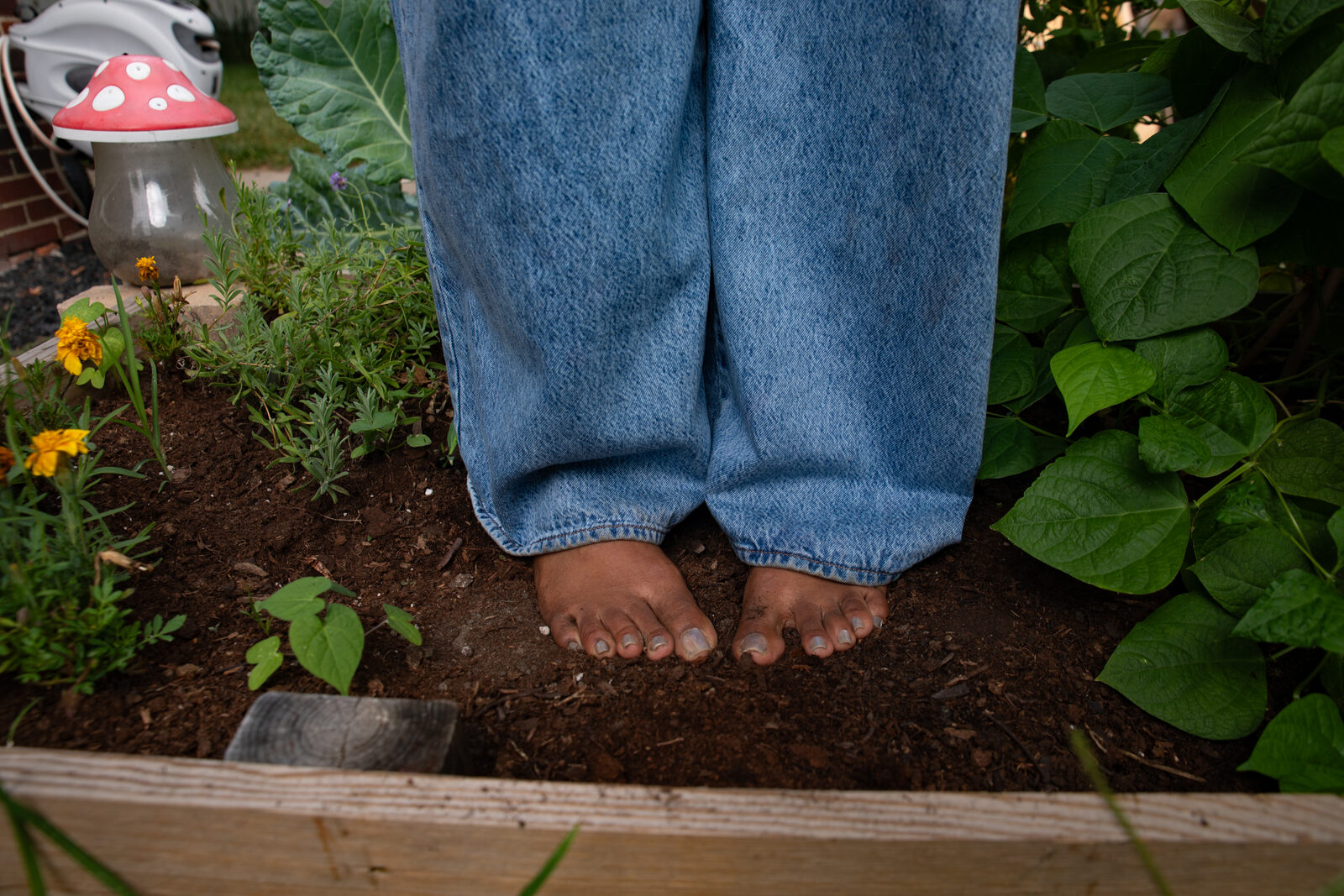 Bare feet in the garden soil